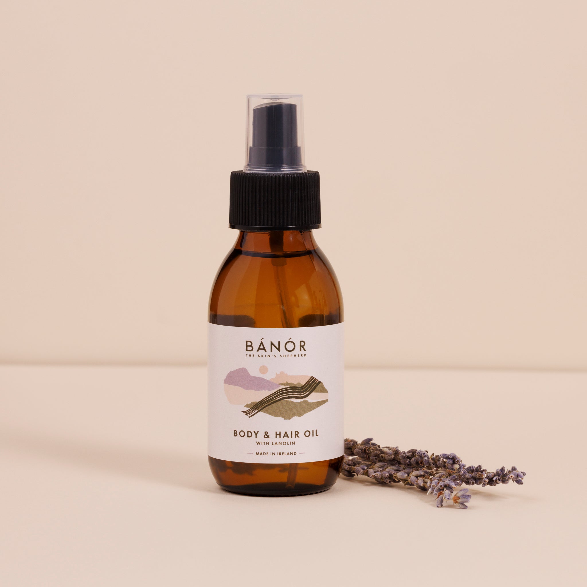 A brown amber bottle with a black spray nozzle labeled &